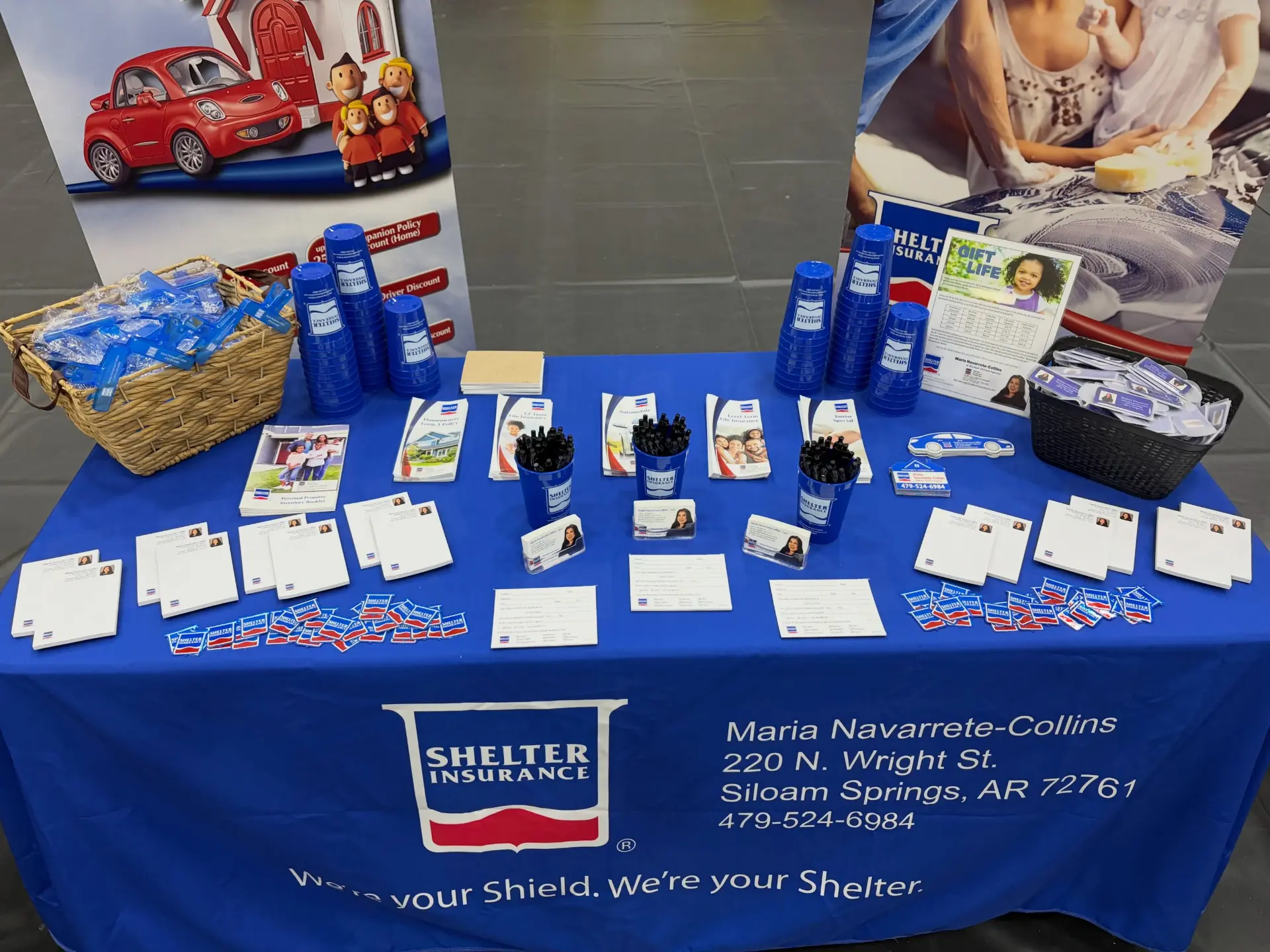The agency's Shelter Insurance booth table set up with brochures and giveaways